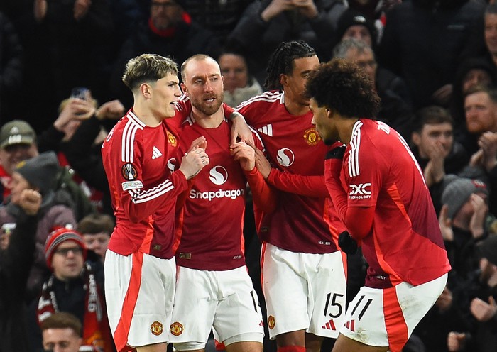 Soccer Football - Europa League - Manchester United v Rangers - Old Trafford, Manchester, Britain - January 23, 2025 Manchester Uniteds Alejandro Garnacho, Manchester Uniteds Christian Eriksen and Manchester Uniteds Leny Yoro celebrate their first goal an own goal scored by Rangers Jack Butland REUTERS/Peter Powell