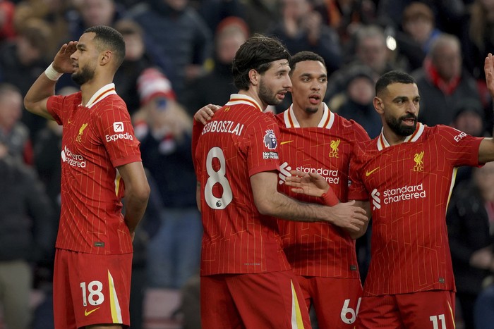 Liverpools Cody Gakpo, from left, Liverpools Dominik Szoboszlai, Liverpools Trent Alexander-Arnold and Liverpools Mohamed Salah celebrate after scoring their sides fourth goal during the English Premier League soccer match between Liverpool and Ipswich Town at Anfield Stadium in Liverpool, Saturday, Jan. 25, 2025.(AP Photo/Ian Hodgson)