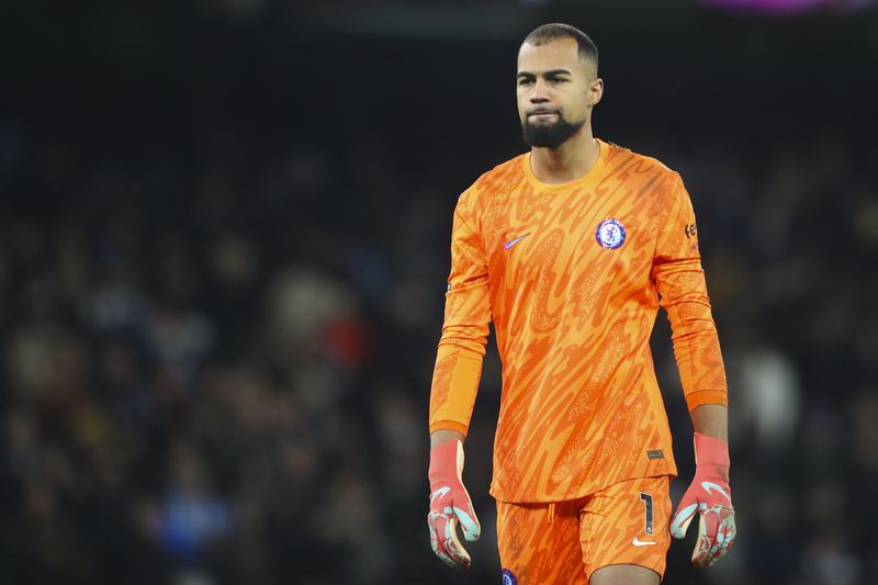Chelsea's goalkeeper Robert Sanchez walks on the pitch at the end of the English Premier League soccer match between Manchester City and Chelsea at Etihad Stadium in Manchester, England, Saturday, Jan. 25, 2025. (AP Photo/Scott Heppell)