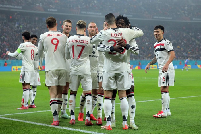 BUCHAREST, ROMANIA - JANUARY 30: Diogo Dalot of Manchester United celebrates scoring his teams first goal with teammate Kobbie Mainoo during the UEFA Europa League 2024/25 League Phase MD8 match between Fotbal Club FCSB and Manchester United at National Arena on January 30, 2025 in Bucharest, Romania. (Photo by Vasile Mihai-Antonio/Getty Images)