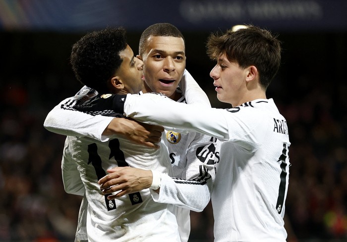 Soccer Football - Champions League - Brest v Real Madrid - Stade de Roudourou, Guingamp, France - January 29, 2025 Real Madrids Rodrygo celebrates scoring their third goal with Kylian Mbappe and Arda Guler REUTERS/Gonzalo Fuentes
