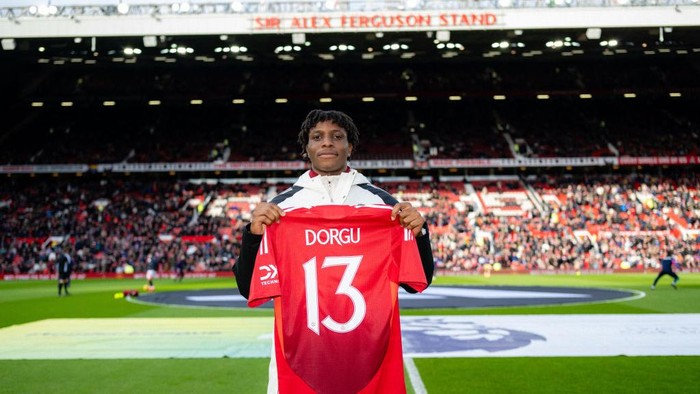 MANCHESTER, ENGLAND - FEBRUARY 02: New signing Patrick Dorgu of Manchester United poses on the pitch ahead of the Premier League match between Manchester United FC and Crystal Palace FC at Old Trafford on February 02, 2025 in Manchester, England. (Photo by Ash Donelon/Manchester United via Getty Images)