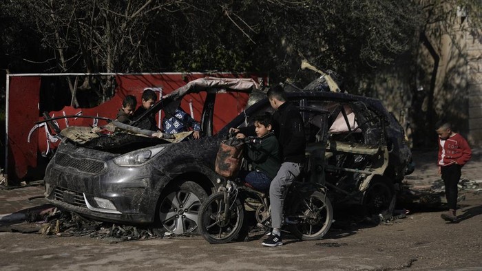 Smoke rises following an explosion detonated by the Israeli army, which said it was destroying buildings used by Palestinian militants in the West Bank Jenin refugee camp, Sunday, Feb. 2, 2025. (AP Photo/Majdi Mohammed)