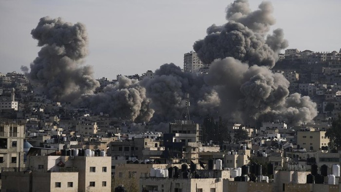 Smoke rises following an explosion detonated by the Israeli army, which said it was destroying buildings used by Palestinian militants in the West Bank Jenin refugee camp, Sunday, Feb. 2, 2025. (AP Photo/Majdi Mohammed)