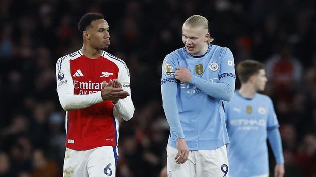 Soccer Football - Premier League - Arsenal v Manchester City - Emirates Stadium, London, Britain - February 2, 2025 Arsenal's Gabriel and Manchester City's Erling Haaland after the match Action Images via Reuters/Peter Cziborra EDITORIAL USE ONLY. NO USE WITH UNAUTHORIZED AUDIO, VIDEO, DATA, FIXTURE LISTS, CLUB/LEAGUE LOGOS OR 'LIVE' SERVICES. ONLINE IN-MATCH USE LIMITED TO 120 IMAGES, NO VIDEO EMULATION. NO USE IN BETTING, GAMES OR SINGLE CLUB/LEAGUE/PLAYER PUBLICATIONS. PLEASE CONTACT YOUR ACCOUNT REPRESENTATIVE FOR FURTHER DETAILS..