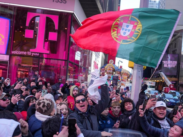 People gather for a statue unveiling in Times Square on the birthday of soccer star Cristiano Ronaldo in New York City, U.S., February 5, 2025. REUTERS/David 'Dee' Delgado