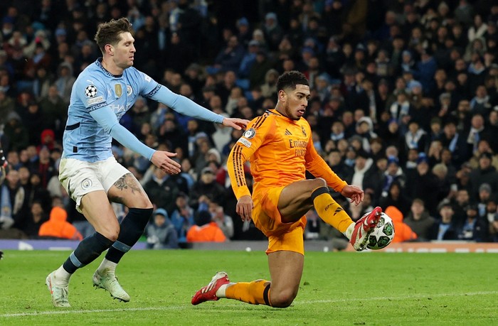 John Stones Soccer Football - Champions League - Knockout Phase Playoff - First Leg - Manchester City v Real Madrid - Etihad Stadium, Manchester, Britain - February 11, 2025 Real Madrid's Jude Bellingham scores their third goal REUTERS/Phil Noble