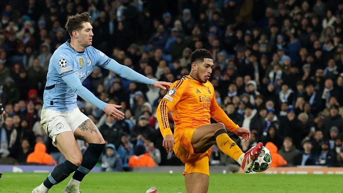 Soccer Football - Champions League - Knockout Phase Playoff - First Leg - Manchester City v Real Madrid - Etihad Stadium, Manchester, Britain - February 11, 2025  Real Madrids Jude Bellingham scores their third goal REUTERS/Phil Noble