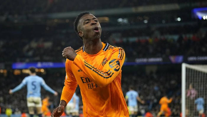 Vinicius Junior Real Madrids Vinicius Junior celebrates after his teammate Real Madrids Brahim Diaz scored their side second goal during the Champions League playoff first leg soccer match between Manchester City and Real Madrid at the Etihad Stadium in Manchester, England, Tuesday, Feb. 11, 2025. (AP Photo/Dave Thompson)