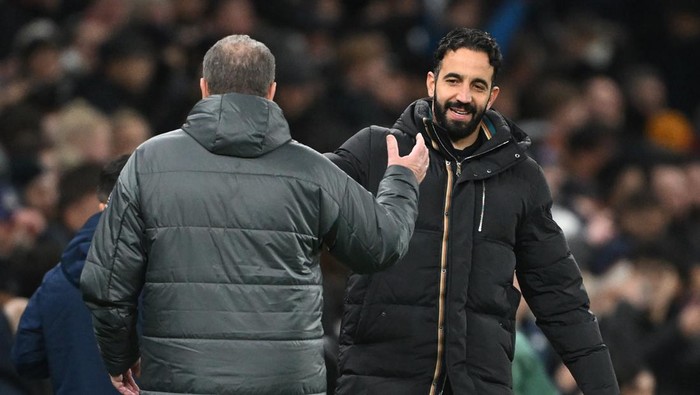 LONDON, ENGLAND - DECEMBER 19: Ruben Amorim, Manager of Manchester United, congratulates Ange Postecoglou, Manager of Tottenham Hotspur, at the end of the Carabao Cup Quarter Final match between Tottenham Hotspur and Manchester United at Tottenham Hotspur Stadium on December 19, 2024 in London, England. (Photo by Shaun Botterill/Getty Images)