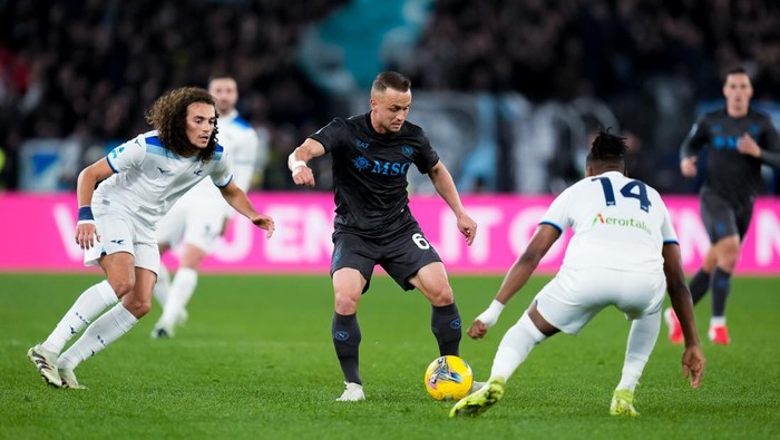 Stanislav Lobotka of SSC Napoli is challenged by Tijjani Noslin of SS Lazio during the Serie A Enilive match between SS Lazio and SSC Napoli at Stadio Olimpico on February 15, 2025 in Rome, Italy. (Photo by Giuseppe Maffia/NurPhoto via Getty Images)