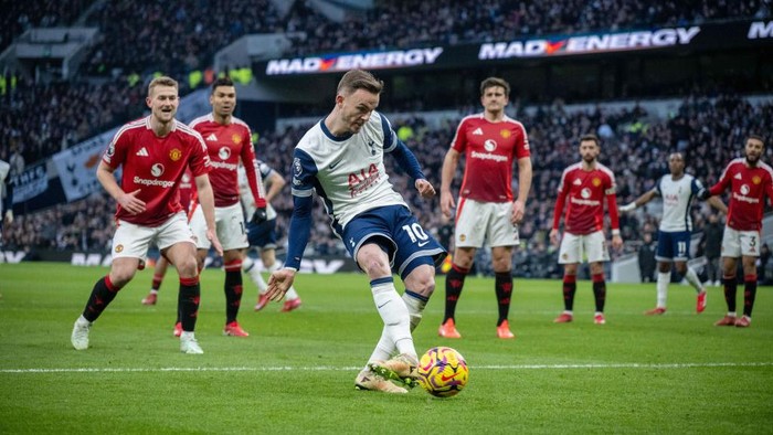 LONDON, ENGLAND - FEBRUARY 16: James Maddison of Tottenham Hotspur FC  scoring a opening goal during the Premier League match between Tottenham Hotspur FC and Manchester United FC at Tottenham Hotspur Stadium on February 16, 2025 in London, England. (Photo by Sebastian Frej/MB Media/Getty Images)