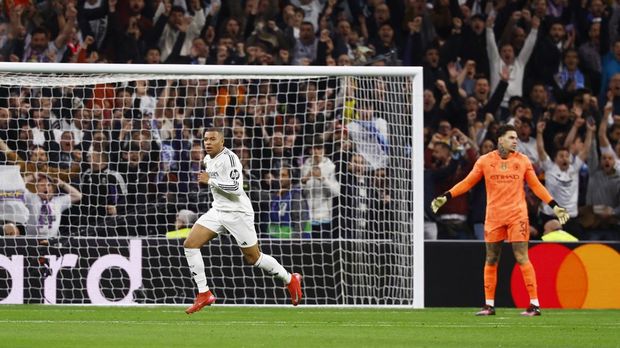 Soccer Football - Champions League - Knockout Phase Playoff - Second Leg - Real Madrid v Manchester City - Santiago Bernabeu, Madrid, Spain - February 19, 2025 Real Madrid's Kylian Mbappe celebrates scoring their first goal REUTERS/Susana Vera