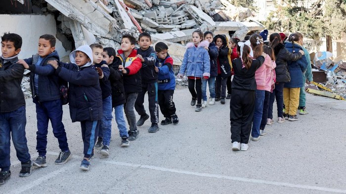 Palestinian children play at a damaged school, amid a ceasefire between Israel and Hamas, in Gaza City, February 25, 2025. REUTERS/Dawoud Abu Alkas