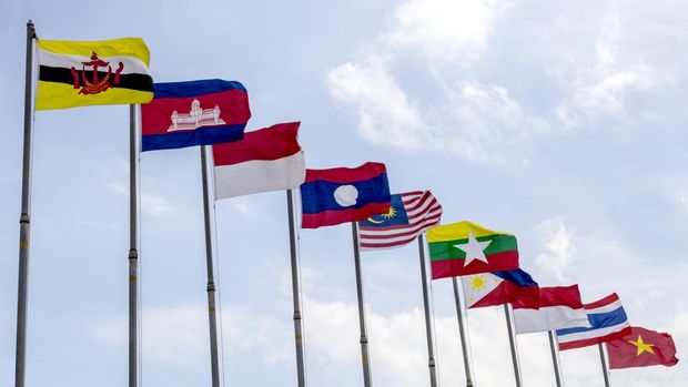 National flags of countries who are member of AEC (ASEAN economic community) on blue sky background