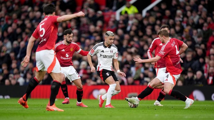 Fulhams Andreas Pereira (centre) is tackled by Manchester Uniteds Matthijs de Ligt (right) during the Emirates FA Cup fifth round match at Old Trafford, Manchester. Picture date: Sunday March 2, 2025. (Photo by Martin Rickett/PA Images via Getty Images)