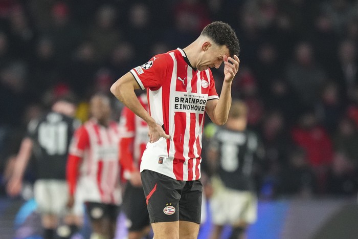 PSVs Ivan Perisic reacts after arsenal scored the sixth goal during the Champions League, round of 16, first leg soccer match between PSV and Arsenal at the Phillips Stadium in Eindhoven, Netherlands, Tuesday, March 4, 2025. (AP Photo/Peter Dejong)