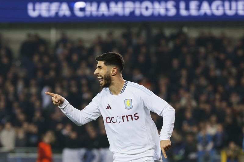 Aston Villa's Marco Asensio celebrates after an own goal by Brugge's Brandon Mechele made it past Brugge's goalkeeper Simon Mignolet during the Champions League round of 16 first leg soccer match between Club Brugge and Aston Villa at the Jan Breydel Stadium in Bruges, Belgium, Tuesday, March 4, 2025. (AP Photo/Geert Vanden Wijngaert)