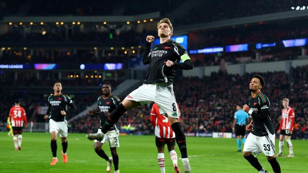 Soccer Football - Champions League - Round of 16 - First Leg - PSV Eindhoven v Arsenal - Philips Stadion, Eindhoven, Netherlands - March 4, 2025  Arsenal's Martin Odegaard celebrates scoring their fourth goal Action Images via Reuters/Matthew Childs