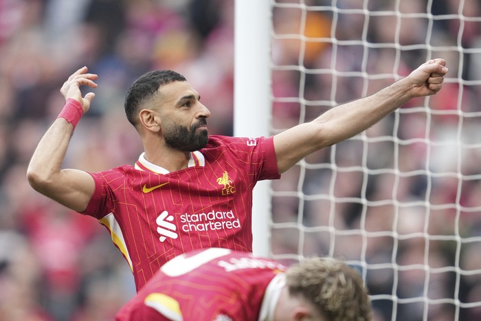 Liverpool's Mohamed Salah celebrates after scoring his side's second goal during the English Premier League soccer match between Liverpool and Southampton at Anfield in Liverpool, Saturday, March 8, 2025. (AP Photo/Jon Super)
