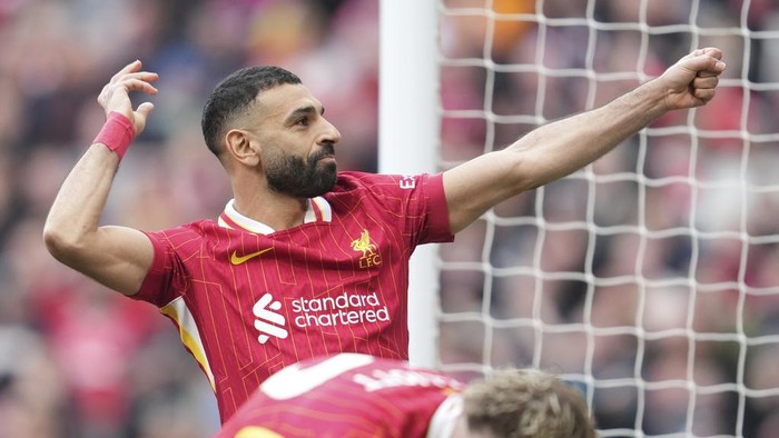 Liverpools Mohamed Salah celebrates after scoring his sides second goal during the English Premier League soccer match between Liverpool and Southampton at Anfield in Liverpool, Saturday, March 8, 2025. (AP Photo/Jon Super)