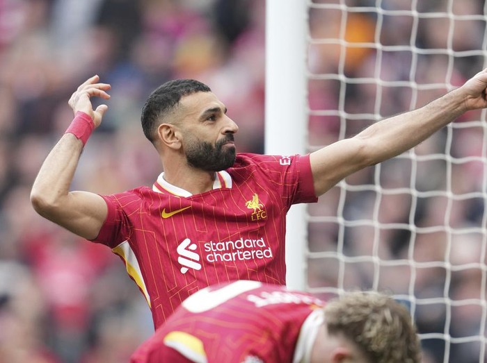 Liverpool's Mohamed Salah celebrates after scoring his side's second goal during the English Premier League soccer match between Liverpool and Southampton at Anfield in Liverpool, Saturday, March 8, 2025. (AP Photo/Jon Super)