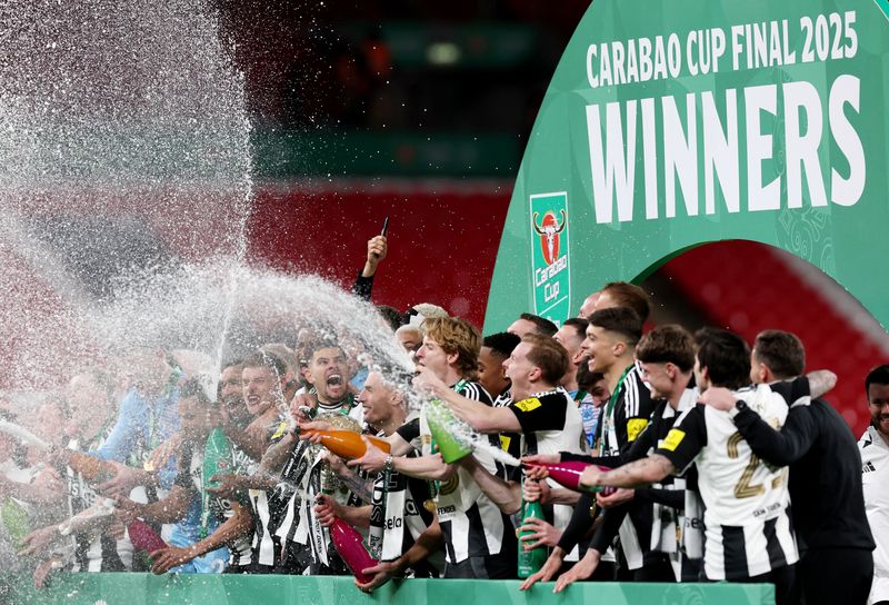 Soccer Football - Carabao Cup - Final - Liverpool v Newcastle United - Wembley Stadium, London, Britain - March 16, 2025 Newcastle United's Bruno Guimaraes celebrates with teammates after winning the Carabao Cup Action Images via Reuters/Paul Childs EDITORIAL USE ONLY. NO USE WITH UNAUTHORIZED AUDIO, VIDEO, DATA, FIXTURE LISTS, CLUB/LEAGUE LOGOS OR 'LIVE' SERVICES. ONLINE IN-MATCH USE LIMITED TO 120 IMAGES, NO VIDEO EMULATION. NO USE IN BETTING, GAMES OR SINGLE CLUB/LEAGUE/PLAYER PUBLICATIONS. PLEASE CONTACT YOUR ACCOUNT REPRESENTATIVE FOR FURTHER DETAILS..