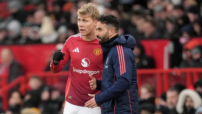 2190438589 Manchester United manager Ruben Amorim (right) speaks to substitute Manchester Uniteds Rasmus Hojlund as he waits to enter the pitch during the Premier League match at Old Trafford, Manchester. Picture date: Sunday December 22, 2024. (Photo by Martin Rickett/PA Images via Getty Images)