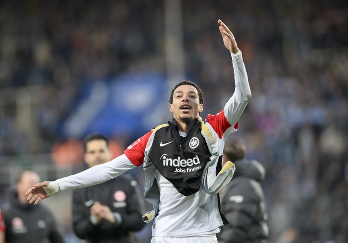 Hugo Ekitike of Eintracht Frankfurt celebrates at the end of the German Bundesliga soccer match between VfL Bochum and Eintracht Frankfurt at the Vonovia Ruhrstadion. in Bochum, Germany, Sunday, March 16, 2025. (Anke Wälischmiller/dpa via AP)