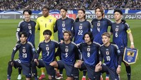 Jepang. Lolos pada 20 Maret 2025, menjadi tim pertama yang lolos ke Piala Dunia 2026 sebagai non-tuan rumah. Foto: AP/Eugene Hoshiko