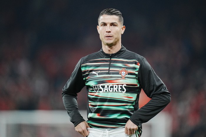 Portugals Cristiano Ronaldo warms up prior to the Nations League playoff soccer match between Denmark and Portugal at Parken in Copenhagen, Thursday, March 20, 2024. (Liselotte Sabroe/Ritzau Scanpix via AP)