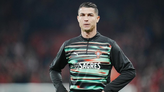 Portugals Cristiano Ronaldo warms up prior to the Nations League playoff soccer match between Denmark and Portugal at Parken in Copenhagen, Thursday, March 20, 2024. (Liselotte Sabroe/Ritzau Scanpix via AP)