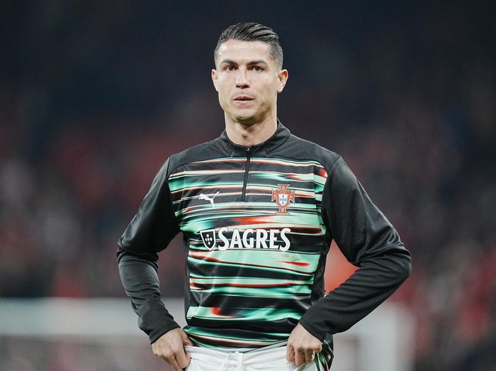 Portugal's Cristiano Ronaldo warms up prior to the Nations League playoff soccer match between Denmark and Portugal at Parken in Copenhagen, Thursday, March 20, 2024. (Liselotte Sabroe/Ritzau Scanpix via AP)