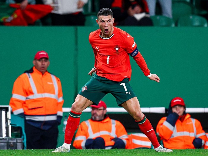 LISBON, PORTUGAL - MARCH 23: Cristiano Ronaldo of Portugal celebrates after scoring his team's second goal during the UEFA Nations League Quarterfinal Leg Two match between Portugal and Denmark at Estadio Jose Alvalade on March 23, 2025 in Lisbon, Portugal. (Photo by Diogo Cardoso/Getty Images)