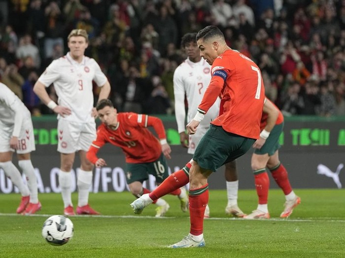 Portugal's Cristiano Ronaldo fails to score with a penalty during the UEFA Nations League soccer match between Portugal and Denmark, at the Jose Alvalade Stadium in Lisbon, Sunday, March 23, 2025. (AP Photo/Armando Franca)