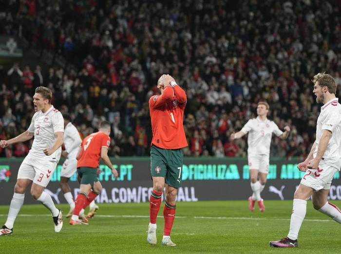 Portugal's Cristiano Ronaldo reacts after he fails to score with a penalty during the UEFA Nations League soccer match between Portugal and Denmark, at the Jose Alvalade Stadium in Lisbon, Sunday, March 23, 2025. (AP Photo/Armando Franca)
