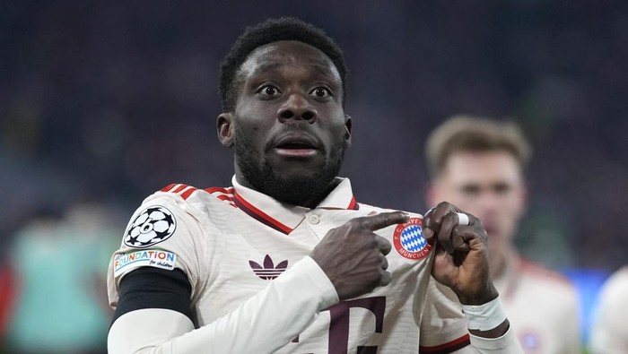 Germany Soccer Champions League Bayerns Alphonso Davies celebrates after scoring his sides opening goal during the Champions League playoff second leg soccer match between FC Bayern Munich and Celtic Glasgow at the Allianz Arena in Munich, Germany, Tuesday, Feb. 18, 2025. (AP Photo/Matthias Schrader)