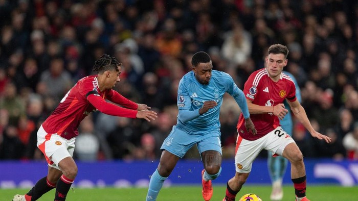 MANCHESTER, ENGLAND - DECEMBER 7: Callum Hudson-Odoi of Nottingham Forest in action with Manuel Ugarte and Leny Yoro of Manchester United during the Premier League match between Manchester United FC and Nottingham Forest FC at Old Trafford on December 7, 2024 in Manchester, England. (Photo by Visionhaus/Getty Images)