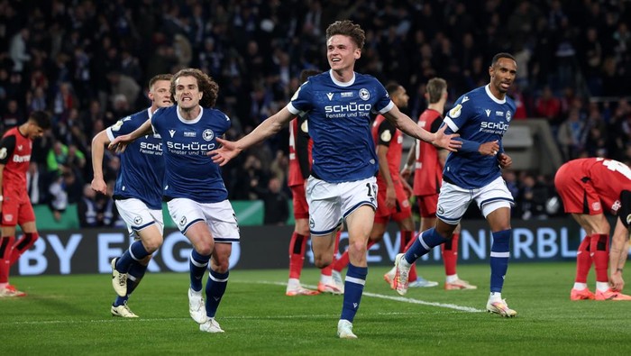 DFB Pokal 01 April 2025, North Rhine-Westphalia, Bielefeld: Soccer: DFB Cup, Arminia Bielefeld - Bayer Leverkusen, semi-final, Schüco Arena. Bielefelds Maximilian Großer celebrates his goal to make it 2:1. IMPORTANT NOTE: In accordance with the regulations of the DFL German Football League and the DFB German Football Association, it is prohibited to use or have used photographs taken in the stadium and/or of the match in the form of sequential images and/or video-like photo series. Photo: Friso Gentsch/dpa (Photo by Friso Gentsch/picture alliance via Getty Images)