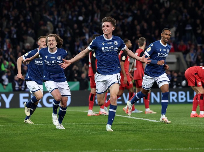 01 April 2025, North Rhine-Westphalia, Bielefeld: Soccer: DFB Cup, Arminia Bielefeld - Bayer Leverkusen, semi-final, Schüco Arena. Bielefeld's Maximilian Großer celebrates his goal to make it 2:1. IMPORTANT NOTE: In accordance with the regulations of the DFL German Football League and the DFB German Football Association, it is prohibited to use or have used photographs taken in the stadium and/or of the match in the form of sequential images and/or video-like photo series. Photo: Friso Gentsch/dpa (Photo by Friso Gentsch/picture alliance via Getty Images)