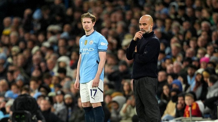 Manchester City substitute Kevin De Bruyne alongside manager Pep Guardiola during the Premier League match at the Etihad Stadium, Manchester. Picture date: Saturday November 23, 2024. (Photo by Martin Rickett/PA Images via Getty Images)