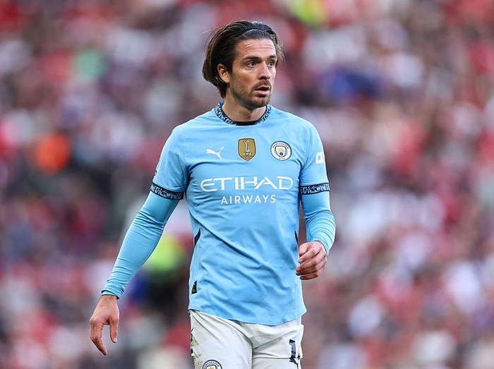 MANCHESTER, ENGLAND - APRIL 6: Jack Grealish of Manchester City during the Premier League match between Manchester United FC and Manchester City FC at Old Trafford on April 6, 2025 in Manchester, England. (Photo by Robbie Jay Barratt - AMA/Getty Images)