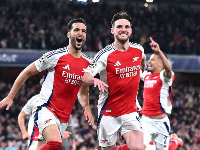 LONDON, ENGLAND - APRIL 08: Mikel Merino of Arsenal celebrates scoring his team's third goal with teammate Declan Rice during the UEFA Champions League 2024/25 Quarter Final First Leg match between Arsenal FC and Real Madrid C.F. at Emirates Stadium on April 08, 2025 in London, England. (Photo by Stuart MacFarlane/Arsenal FC via Getty Images)
