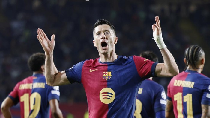 Robert Lewandowski Barcelonas Robert Lewandowski celebrates after scoring his sides third goal during the Champions League quarterfinals first leg soccer match between Barcelona and Borussia Dortmund, at the Lluis Companys Olympic stadium in Barcelona, Spain, Wednesday, April 9, 2025. (AP Photo/Joan Monfort)