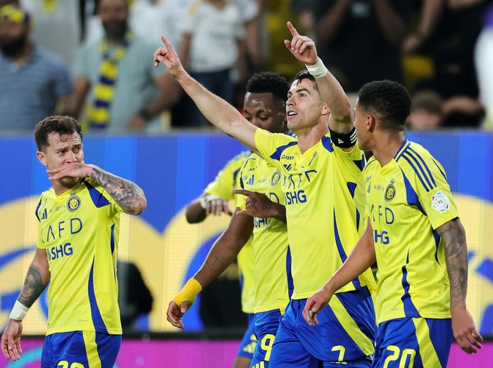 RIYADH, SAUDI ARABIA - APRIL 12: Cristiano Ronaldo of Al Nassr celebrates scoring his team's second goal with teammates during the Saudi Pro League match between Al Nassr v Al Riyadh at Al-Awwal Park on April 12, 2025 in Riyadh, Saudi Arabia. (Photo by Abdullah Ahmed/Getty Images)