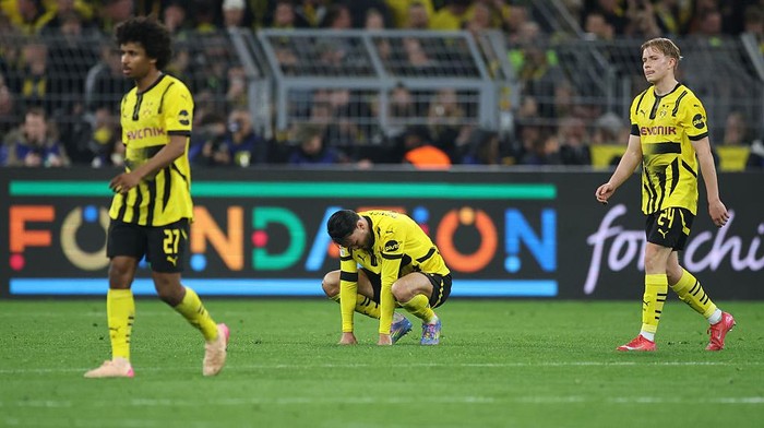 DORTMUND, GERMANY - APRIL 15: Ramy Bensebaini of Borussia Dortmund reacts during the UEFA Champions League 2024/25 Quarter Final Second Leg match between Borussia Dortmund and FC Barcelona at BVB Stadion Dortmund on April 15, 2025 in Dortmund, Germany. (Photo by Alex Grimm/Getty Images)