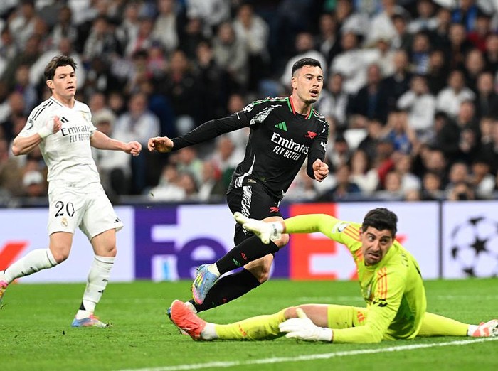MADRID, SPAIN - APRIL 16: Gabriel Martinelli of Arsenal looks on after scoring his team's second goal past Thibaut Courtois of Real Madrid  during the UEFA Champions League 2024/25 Quarter Final Second Leg match between Real Madrid C.F. and Arsenal FC at Estadio Santiago Bernabeu on April 16, 2025 in Madrid, Spain. (Photo by Stuart MacFarlane/Arsenal FC via Getty Images)