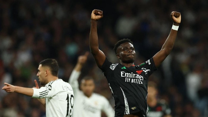 Soccer Football - Champions League - Quarter Final - Second Leg - Real Madrid v Arsenal - Santiago Bernabeu, Madrid, Spain - April 16, 2025 Arsenals Bukayo Saka celebrates scoring their first goal Action Images via Reuters/Lee Smith