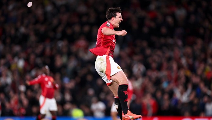 MANCHESTER, ENGLAND - APRIL 17: Harry Maguire of Manchester United  celebrates after scoring a goal to make it 5-4  during the UEFA Europa League 2024/25 Quarter Final Second Leg match between Manchester United and Olympique Lyonnais at Old Trafford on April 17, 2025 in Manchester, England. (Photo by Robbie Jay Barratt - AMA/Getty Images)
