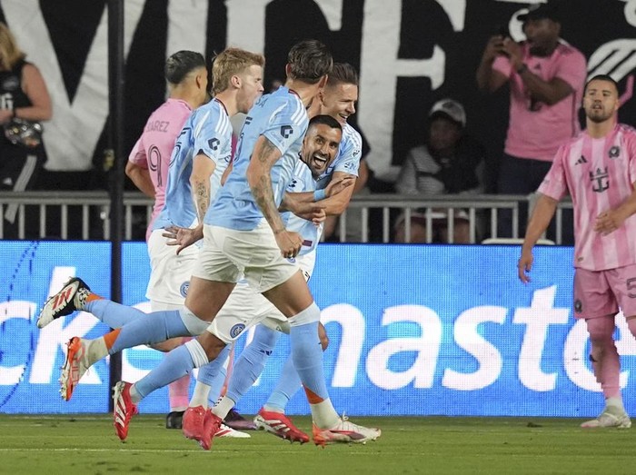 New York City FC players, including midfielder Santiago Rodriguez, center left, celebrate after their side scored their first goal, during the first half of an MLS soccer match, Saturday, Feb. 22, 2025, in Fort Lauderdale, Fla. (AP Photo/Rebecca Blackwell)